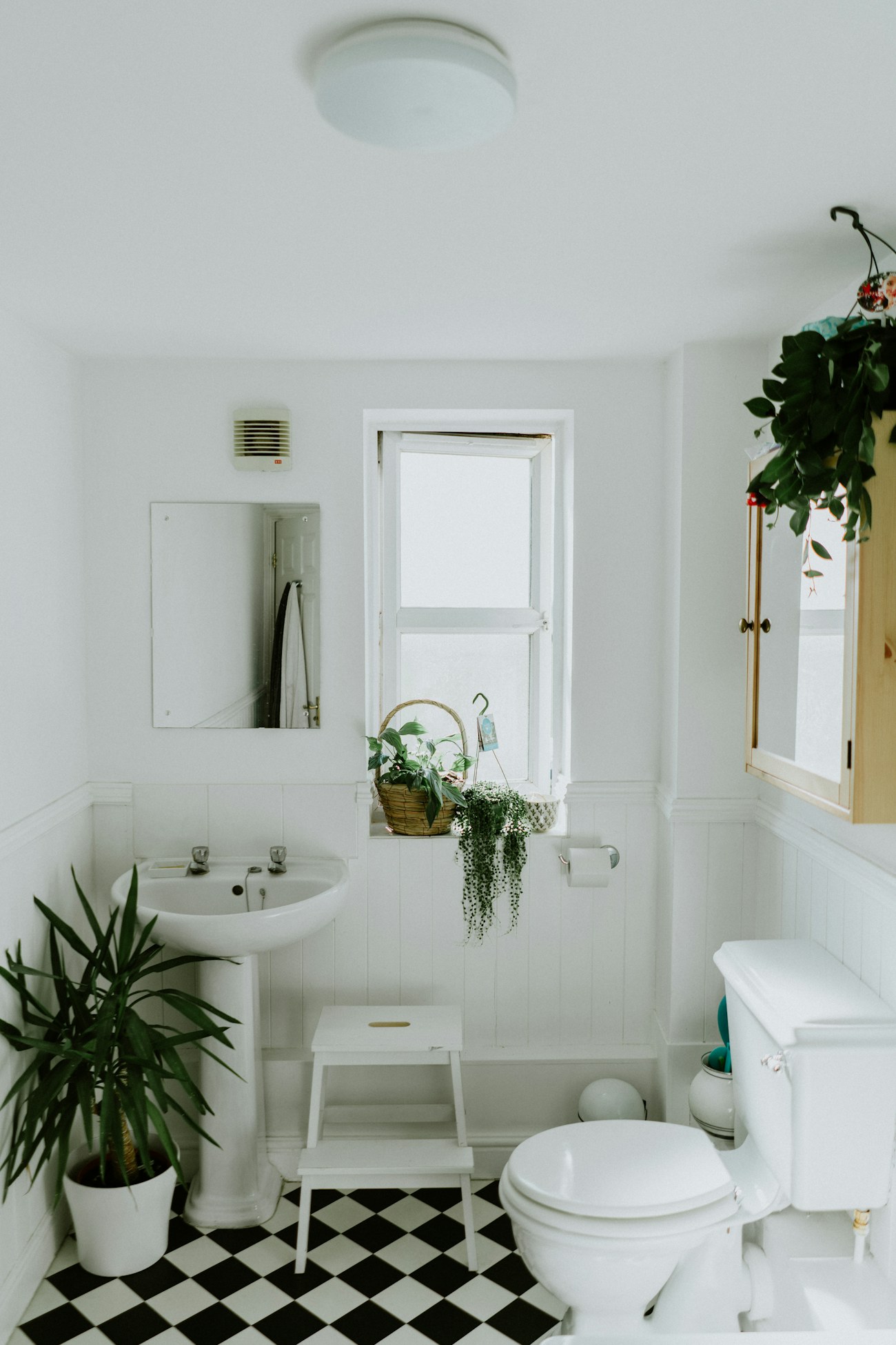 A clean, bright bathroom with polished tiles and fittings